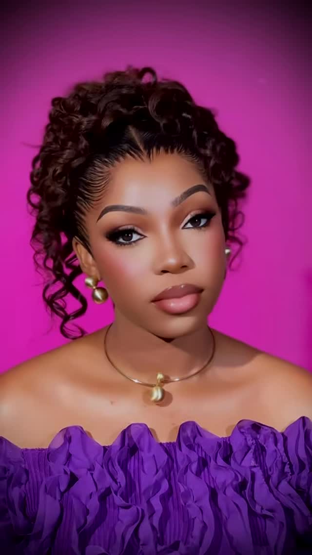 Bold occasion makeup with curls.